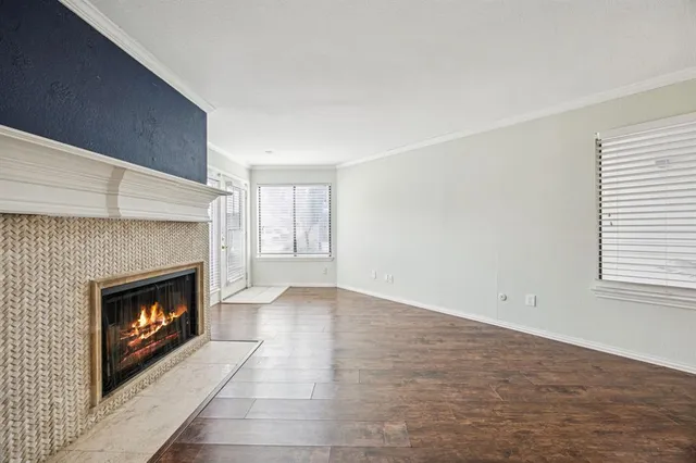 a view of empty room with a fireplace