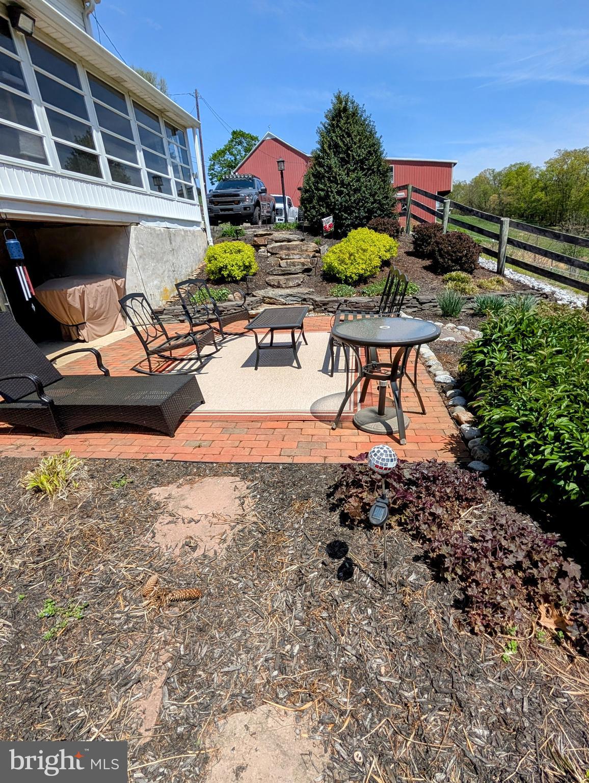 12706 High Point Road Felton, PA 17322 - Photo 26 of 56 a backyard of a house with table and chairs