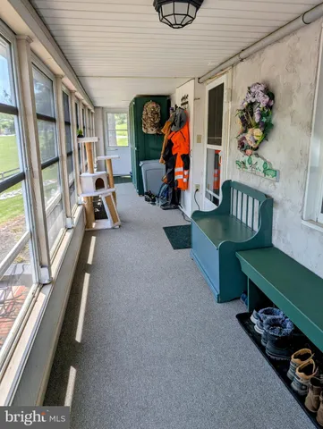 a bathroom with a granite countertop toilet sink and mirror