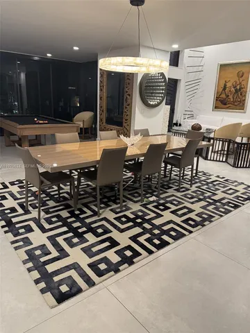 a kitchen with a table and chairs