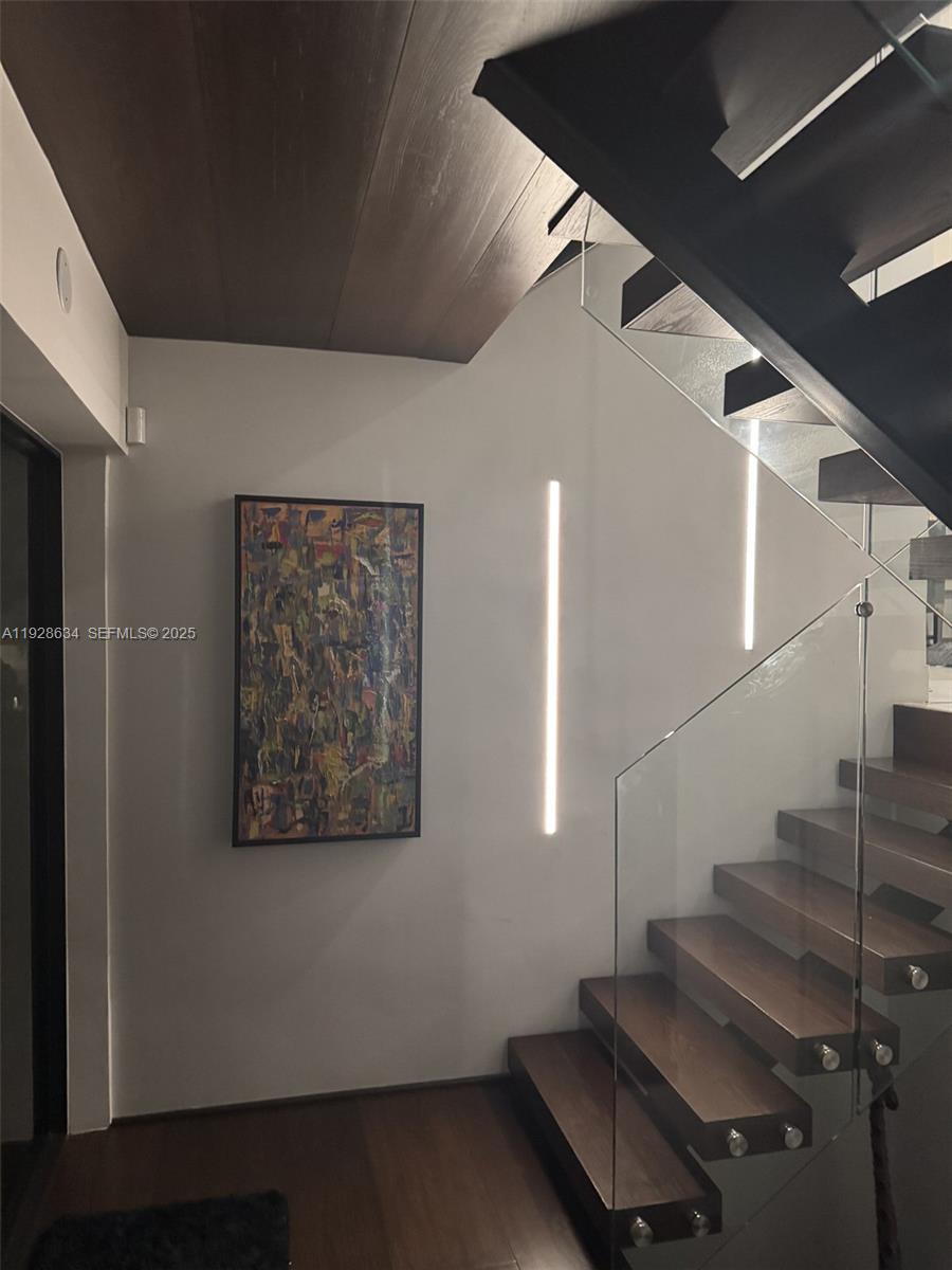 2000 South Bayshore Drive, Unit 46 Miami, FL 33133 - Photo 11 of 15 a view of staircase with white walls