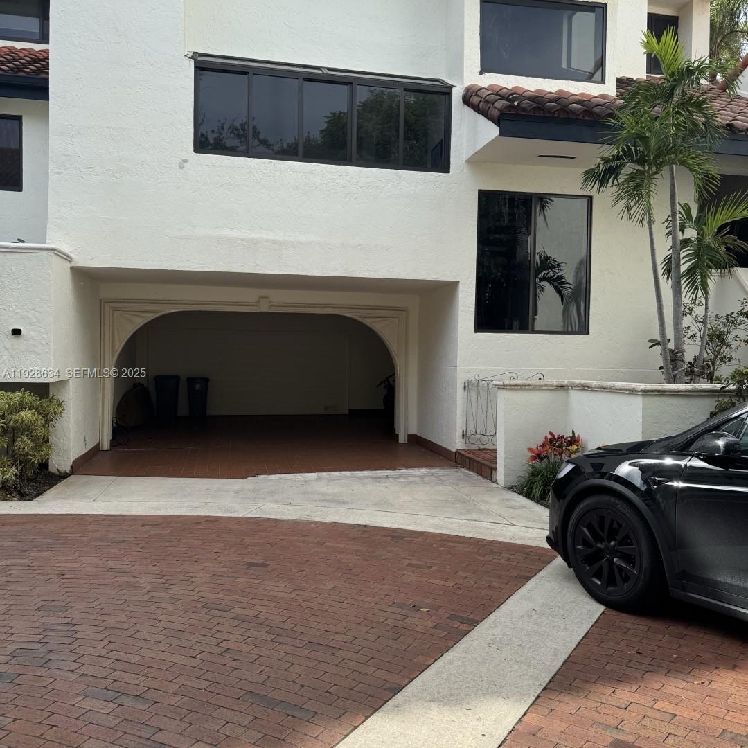 2000 South Bayshore Drive, Unit 46 Miami, FL 33133 - Photo 12 of 15 a car parked in front of house