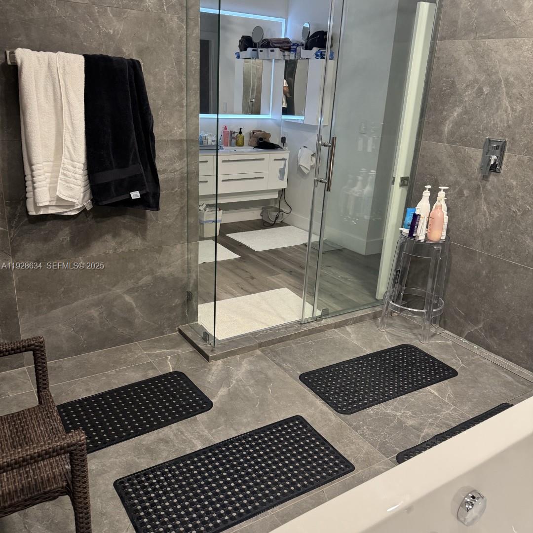 2000 South Bayshore Drive, Unit 46 Miami, FL 33133 - Photo 14 of 15 a bathroom with a sink and a mirror