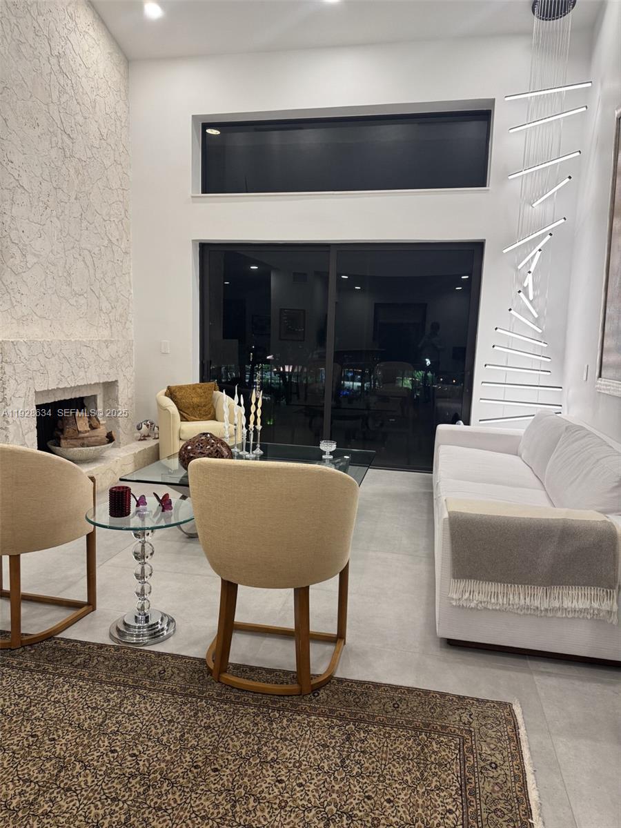 2000 South Bayshore Drive, Unit 46 Miami, FL 33133 - Photo 4 of 15 a living room with furniture and a fireplace