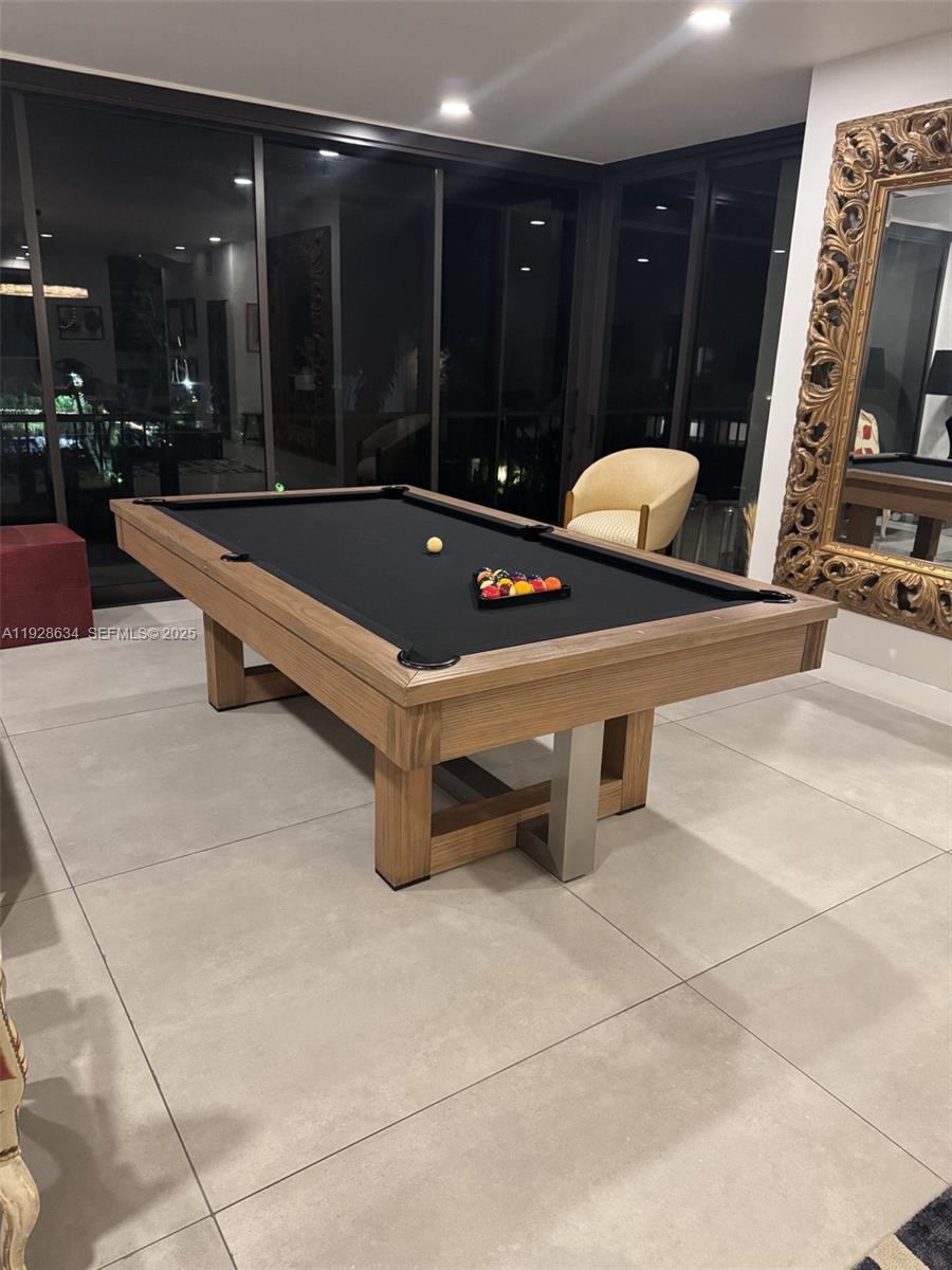2000 South Bayshore Drive, Unit 46 Miami, FL 33133 - Photo 6 of 15 a room with pool table and glass door