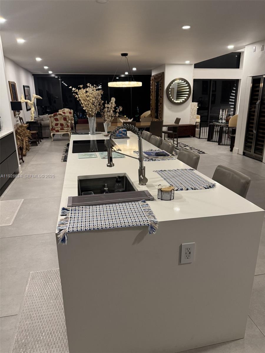 2000 South Bayshore Drive, Unit 46 Miami, FL 33133 - Photo 7 of 15 a kitchen with stainless steel appliances a stove a refrigerator and cabinets