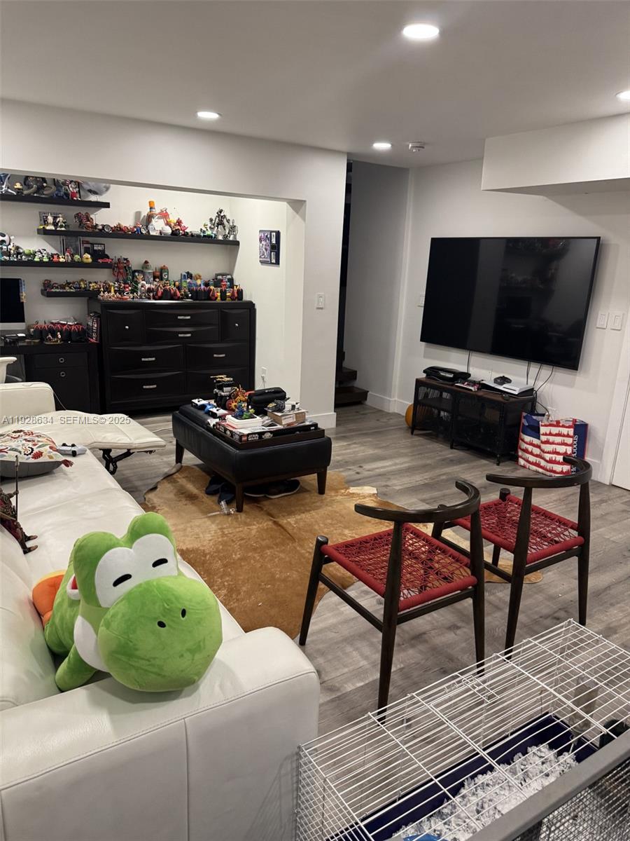 2000 South Bayshore Drive, Unit 46 Miami, FL 33133 - Photo 9 of 15 a living room with furniture and a flat screen tv