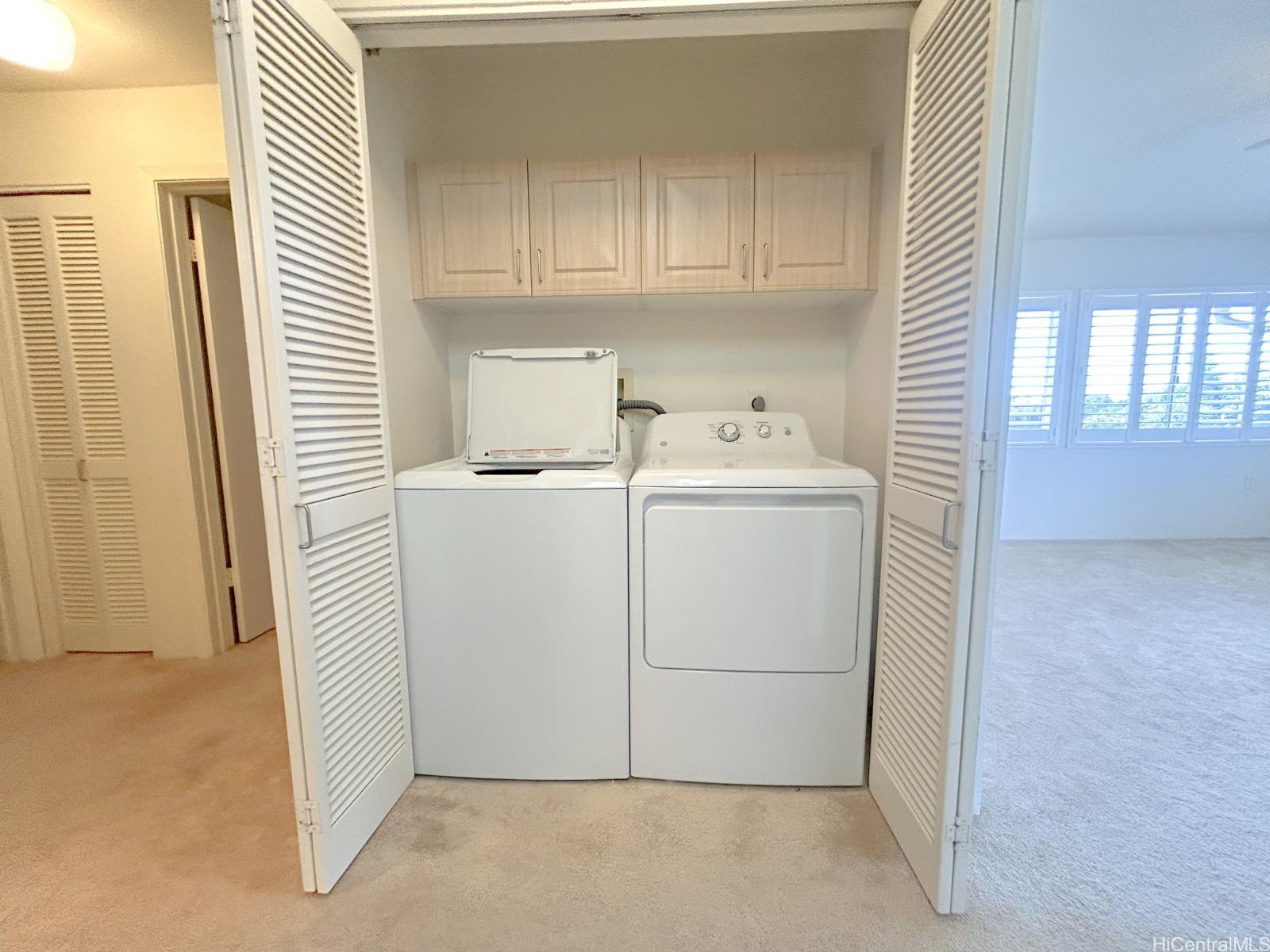 92-1459 Ali'inui Drive, Unit 24A Kapolei, HI 96707 - Photo 7 of 9 a utility room with dryer and washer