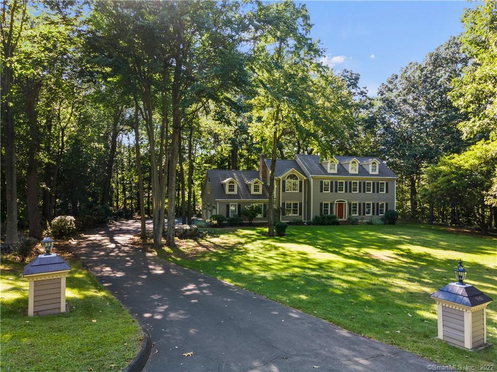 980 Old Coach Road Orange, CT 06477 - Photo 1 of 1 a front view of a house with a yard