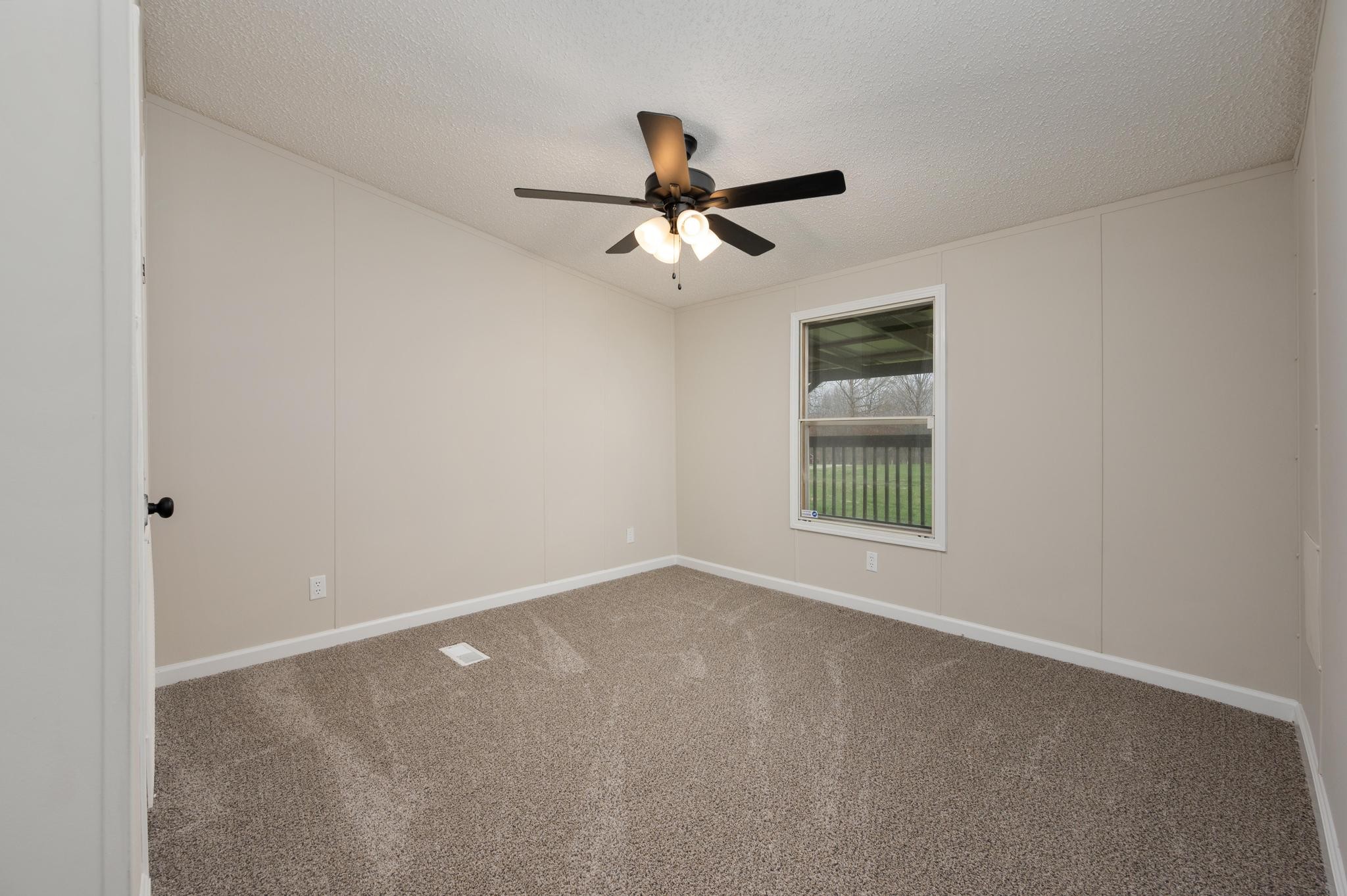 6475 North Pinson Road Portland, TN 37148 - Photo 18 of 23 a view of an empty room with a window