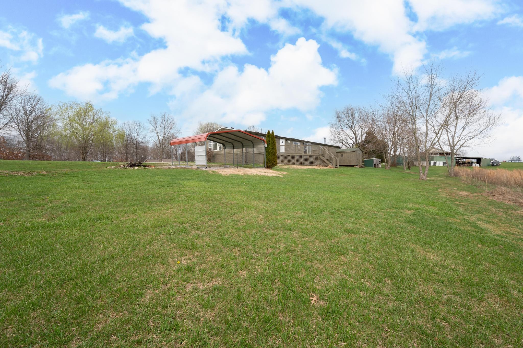 6475 North Pinson Road Portland, TN 37148 - Photo 23 of 23 a view of a field of grass and trees