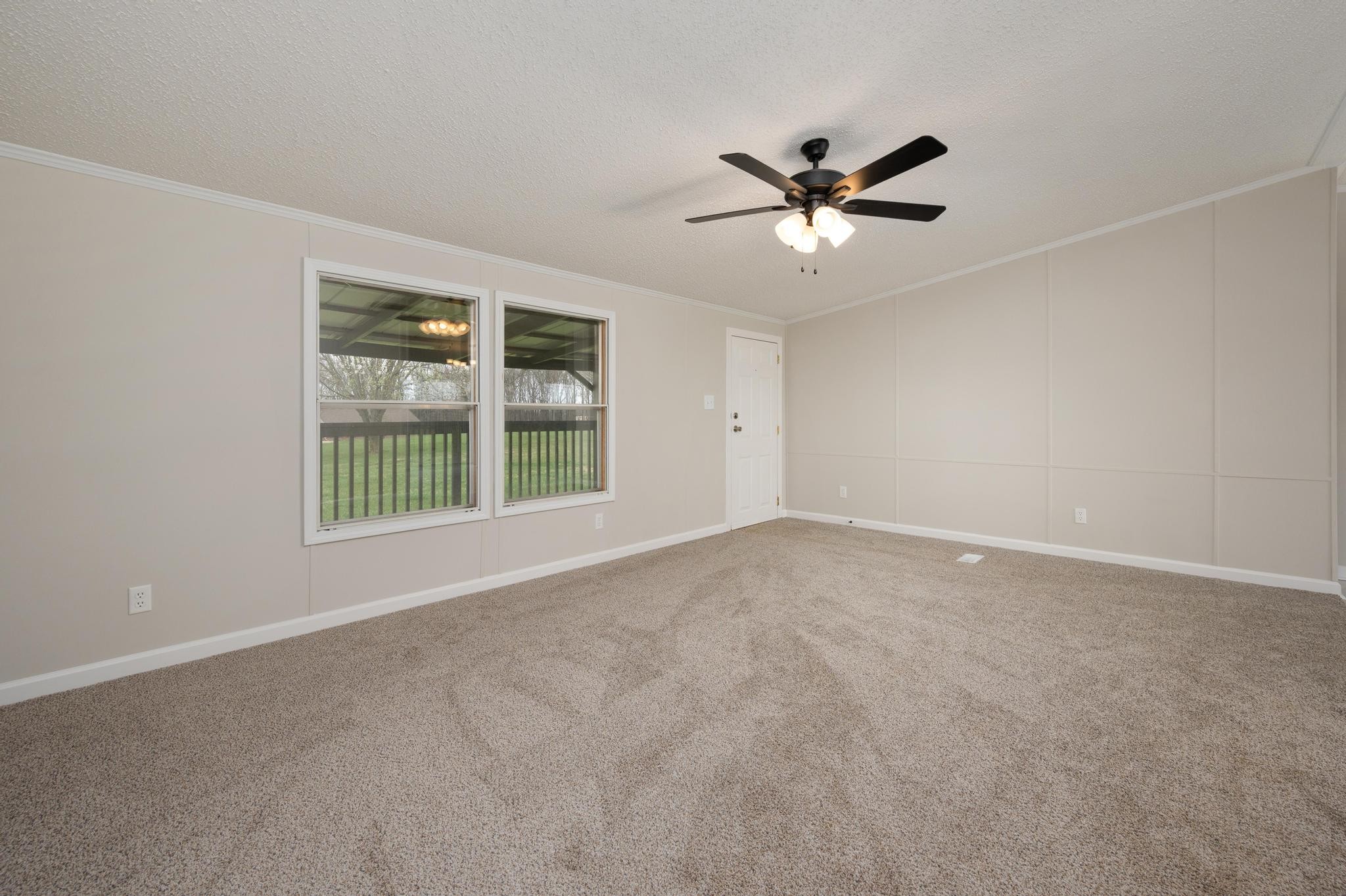 6475 North Pinson Road Portland, TN 37148 - Photo 4 of 23 a view of a livingroom with a ceiling fan and window