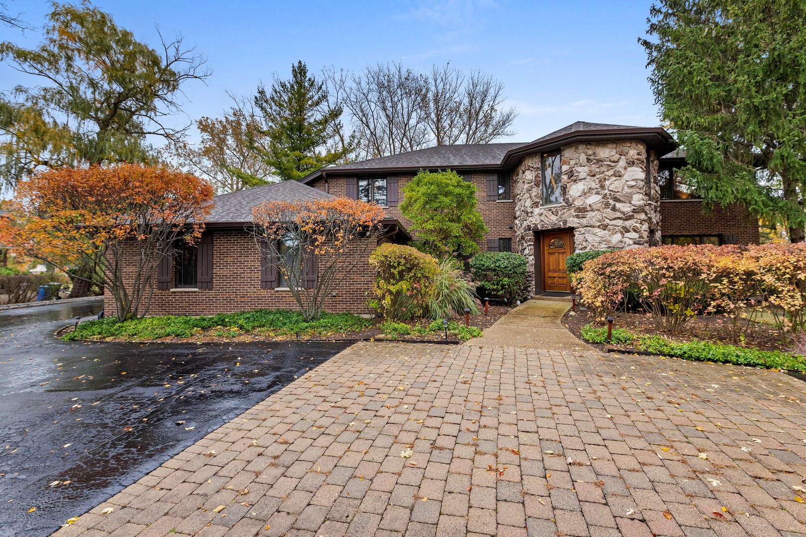 1051 Saunders Road Riverwoods, IL 60015 - Photo 1 of 37 a front view of a house with garden