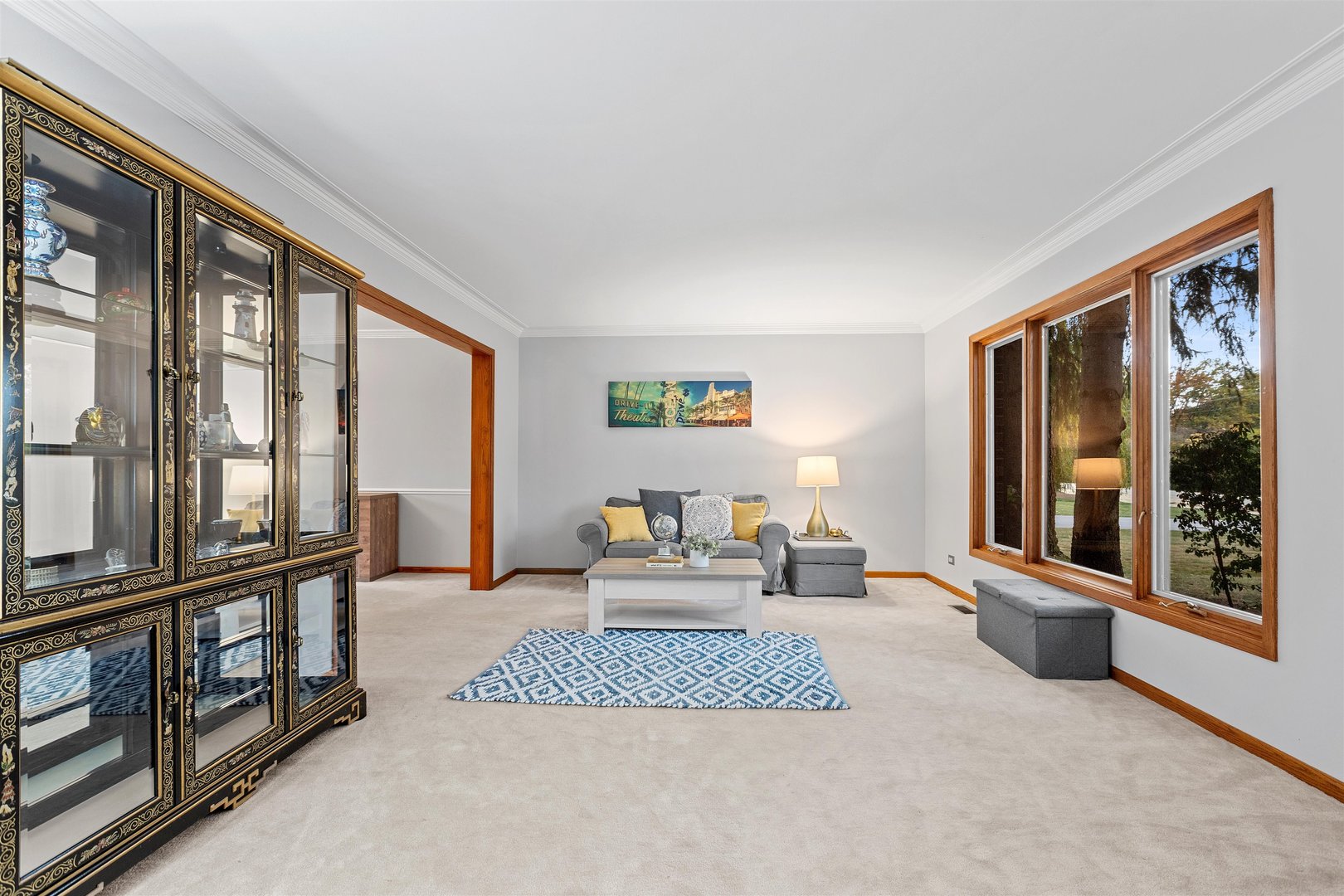 1051 Saunders Road Riverwoods, IL 60015 - Photo 2 of 37 a living room with furniture and large windows