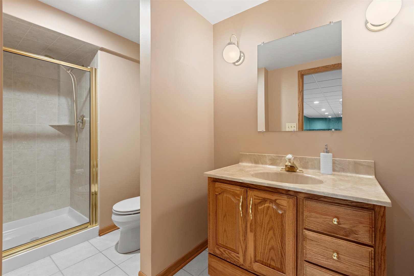 1051 Saunders Road Riverwoods, IL 60015 - Photo 27 of 37 a bathroom with a toilet sink and mirror