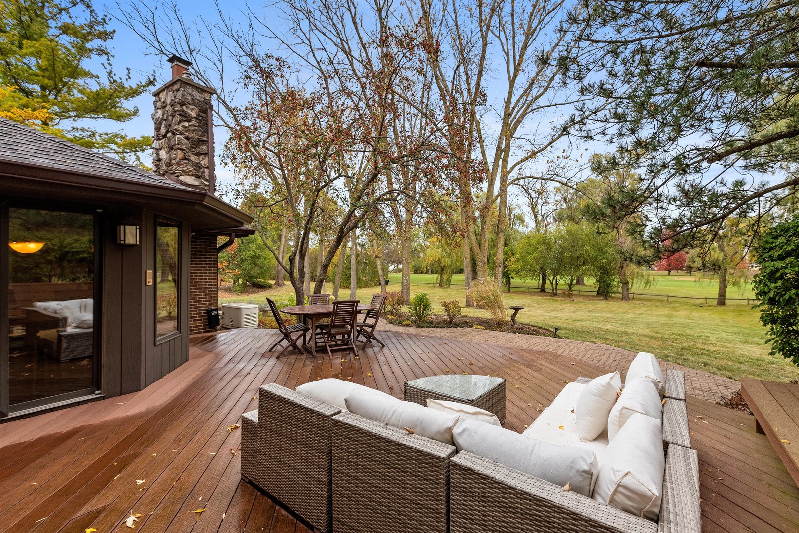 1051 Saunders Road Riverwoods, IL 60015 - Photo 28 of 37 a view of a swimming pool with a couches and lounge chairs