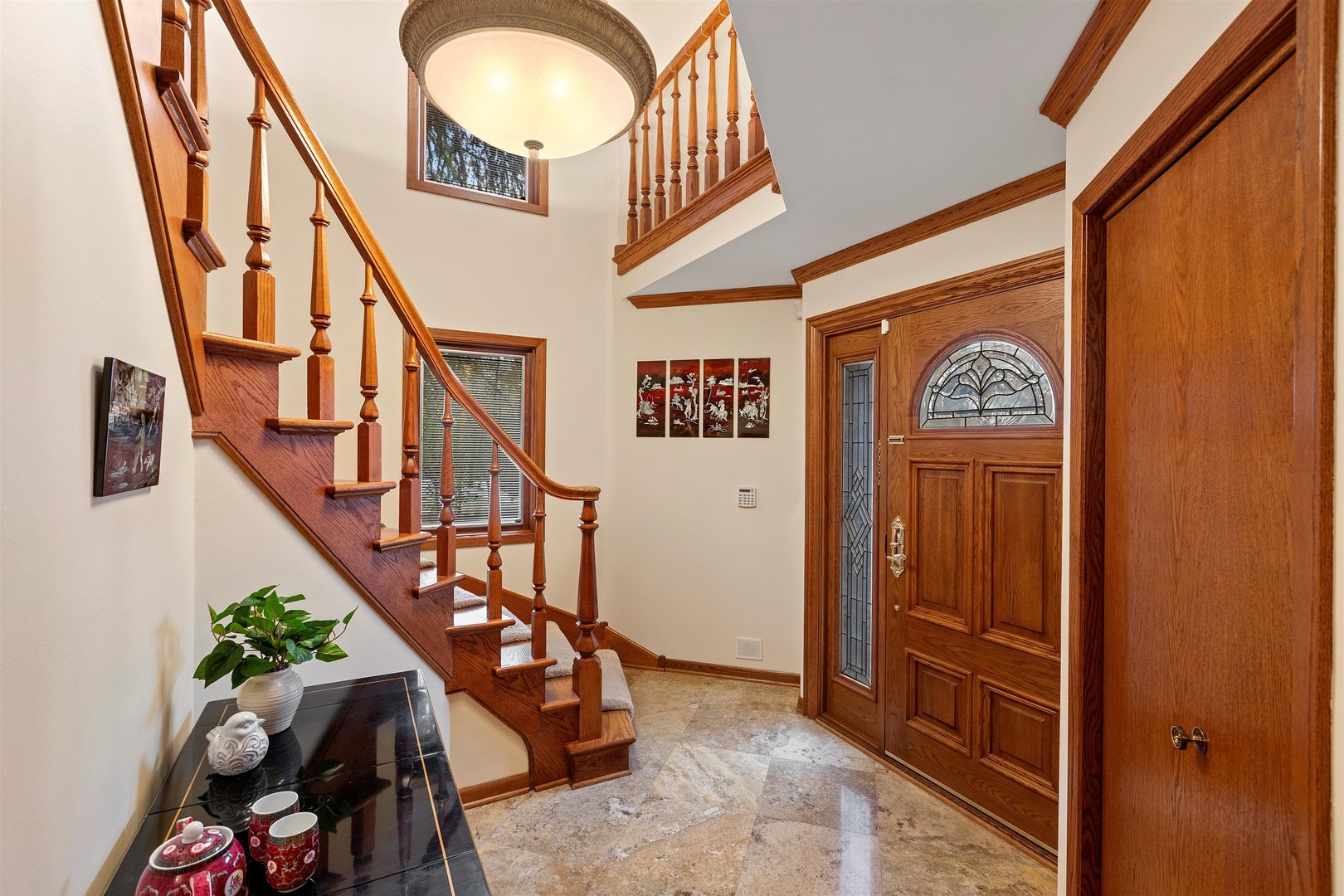 1051 Saunders Road Riverwoods, IL 60015 - Photo 34 of 37 a view of an entryway with wooden floor and stairs