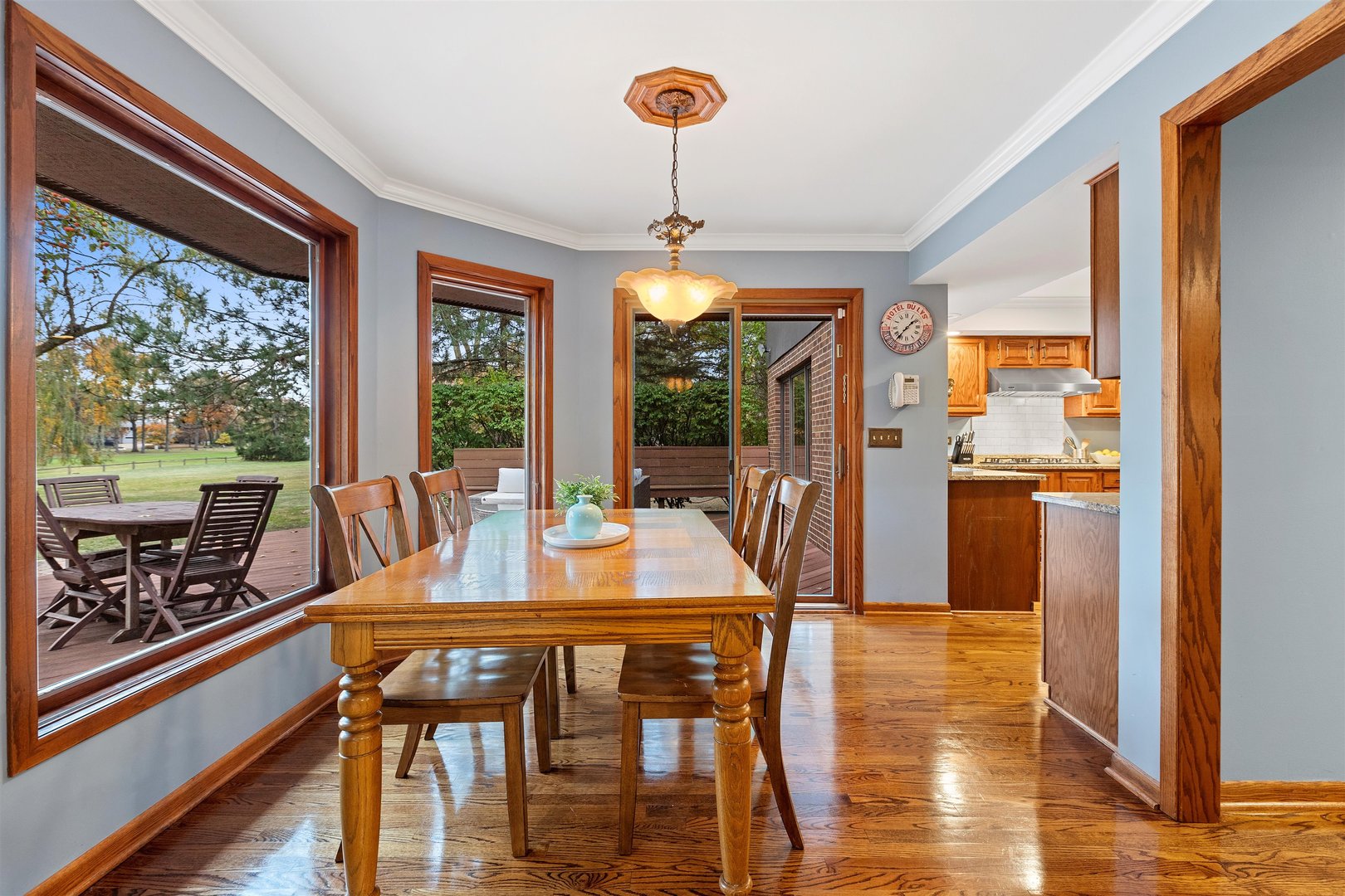 1051 Saunders Road Riverwoods, IL 60015 - Photo 7 of 37 a view of a dining room with furniture window and wooden floor