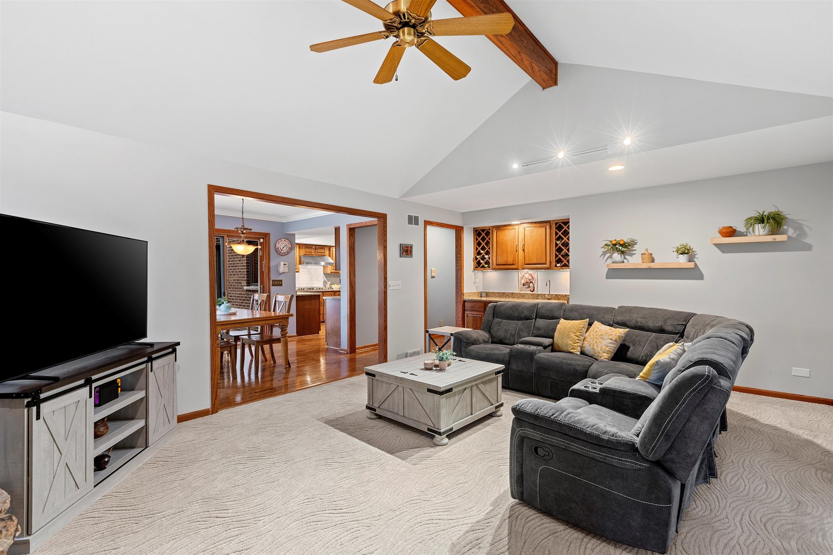 1051 Saunders Road Riverwoods, IL 60015 - Photo 9 of 37 a living room with furniture and a flat screen tv