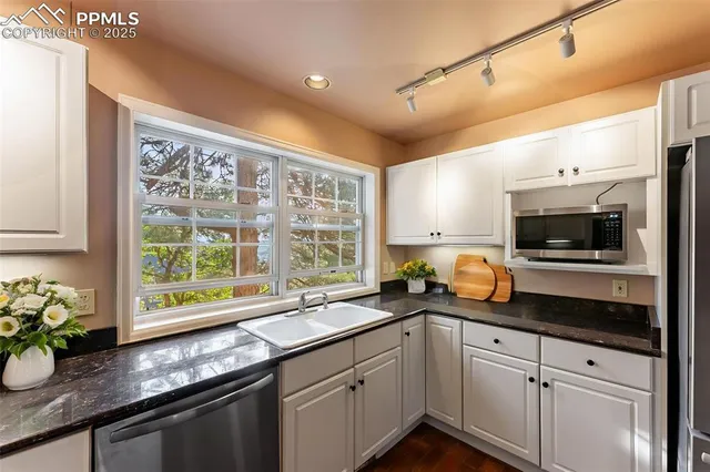 a kitchen with a sink and a microwave