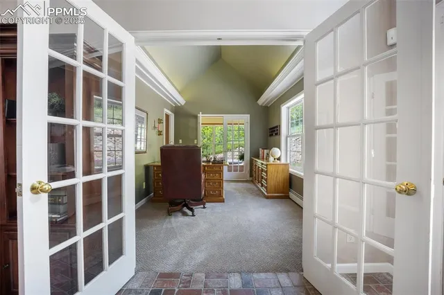 a work room with furniture and windows
