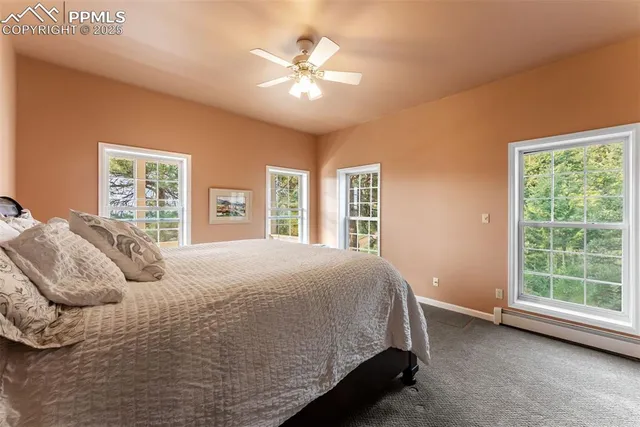 a spacious bedroom with a bed and a window