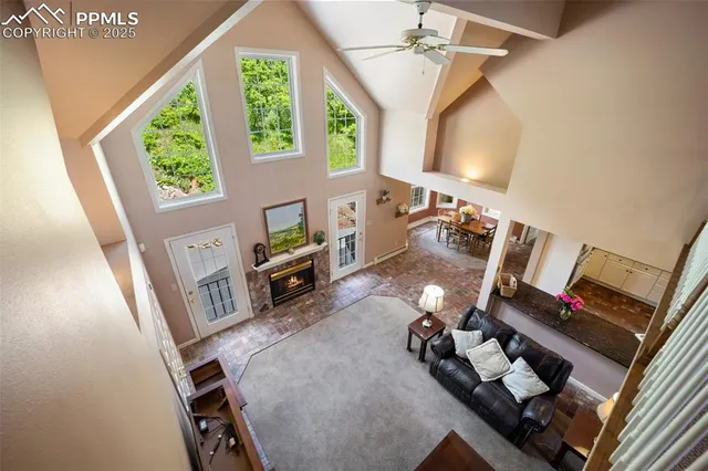 a spacious bedroom with a bed and a lamp