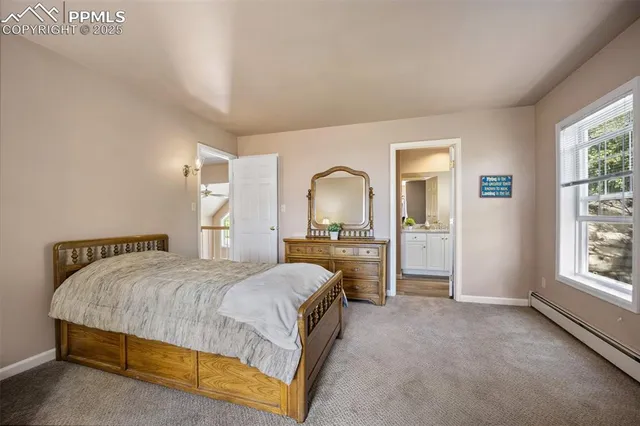 a bathroom with a granite countertop sink a mirror and a shower