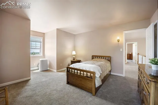 a bathroom with a granite countertop sink toilet and a mirror
