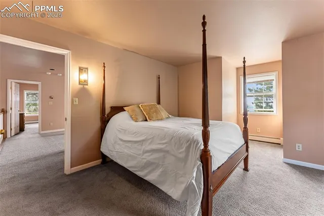 a bathroom with a granite countertop sink mirror and toilet