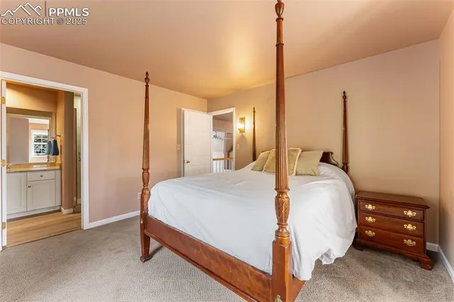 a room with furniture a refrigerator and a dresser