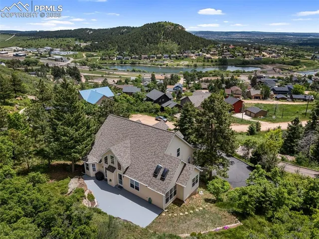 an aerial view of a house with a garden