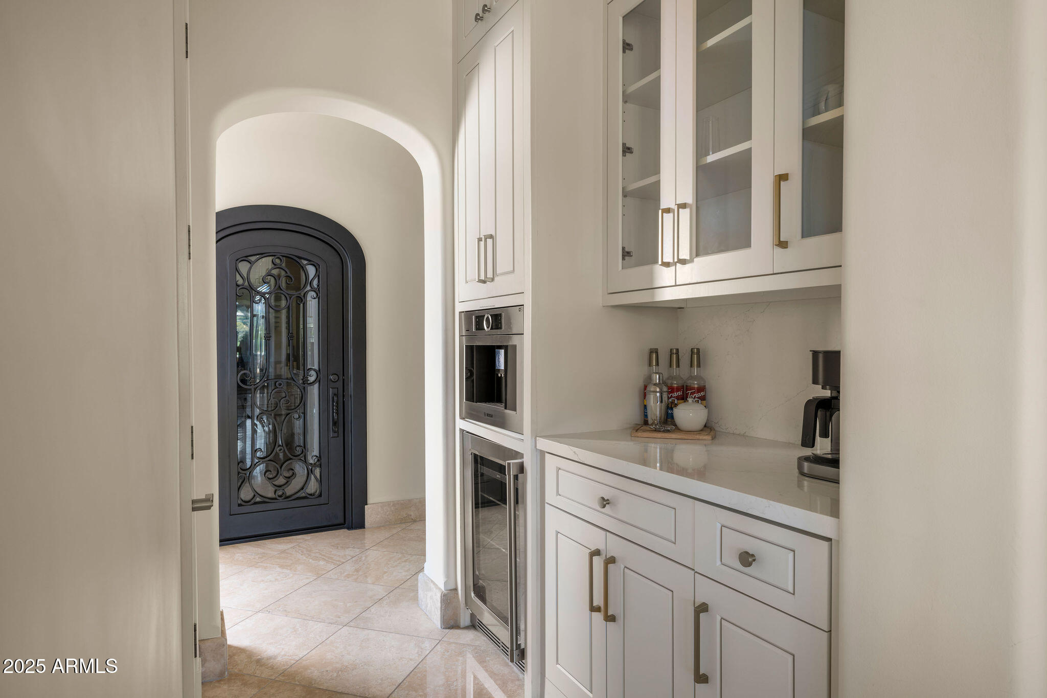 4490 East Valley Vista Lane Paradise Valley, AZ 85253 - Photo 17 of 45 a close view of cabinet and tap
