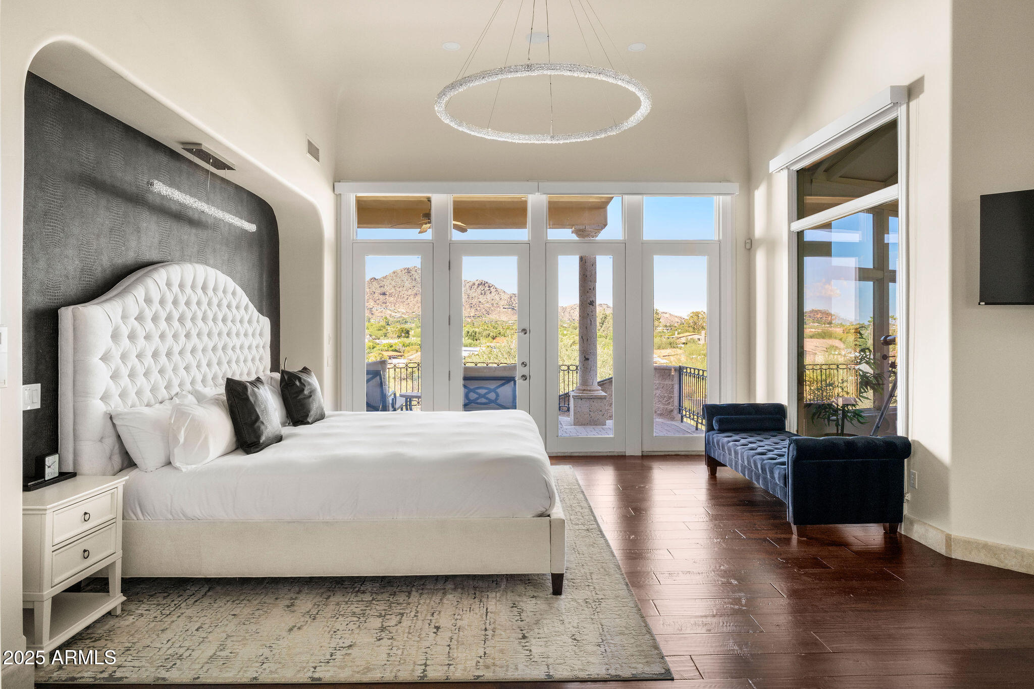 4490 East Valley Vista Lane Paradise Valley, AZ 85253 - Photo 24 of 45 a bedroom with a large bed and a large window