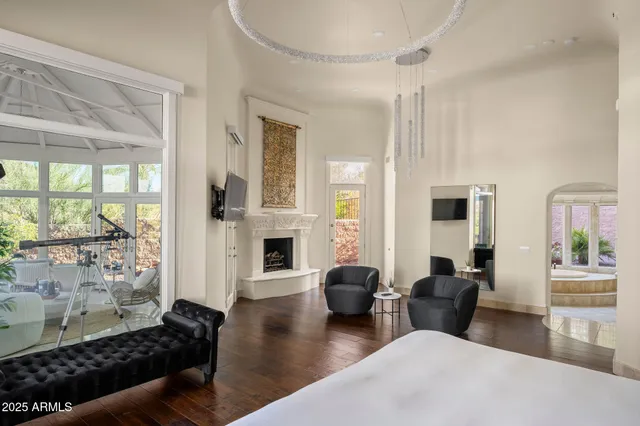 a large bathroom with a large tub sink and mirror