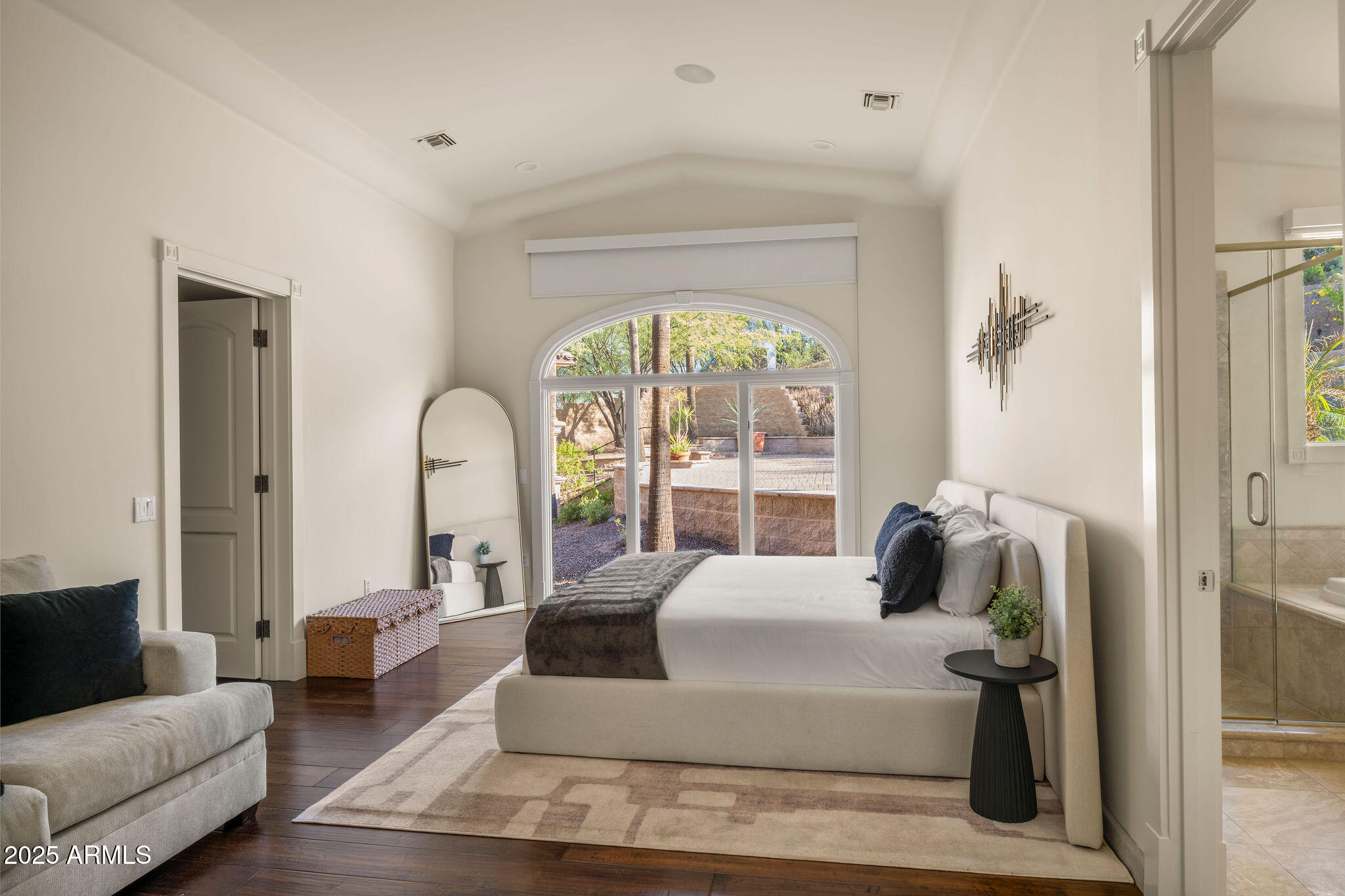 4490 East Valley Vista Lane Paradise Valley, AZ 85253 - Photo 29 of 45 a large white couch sitting in a living room next to a window