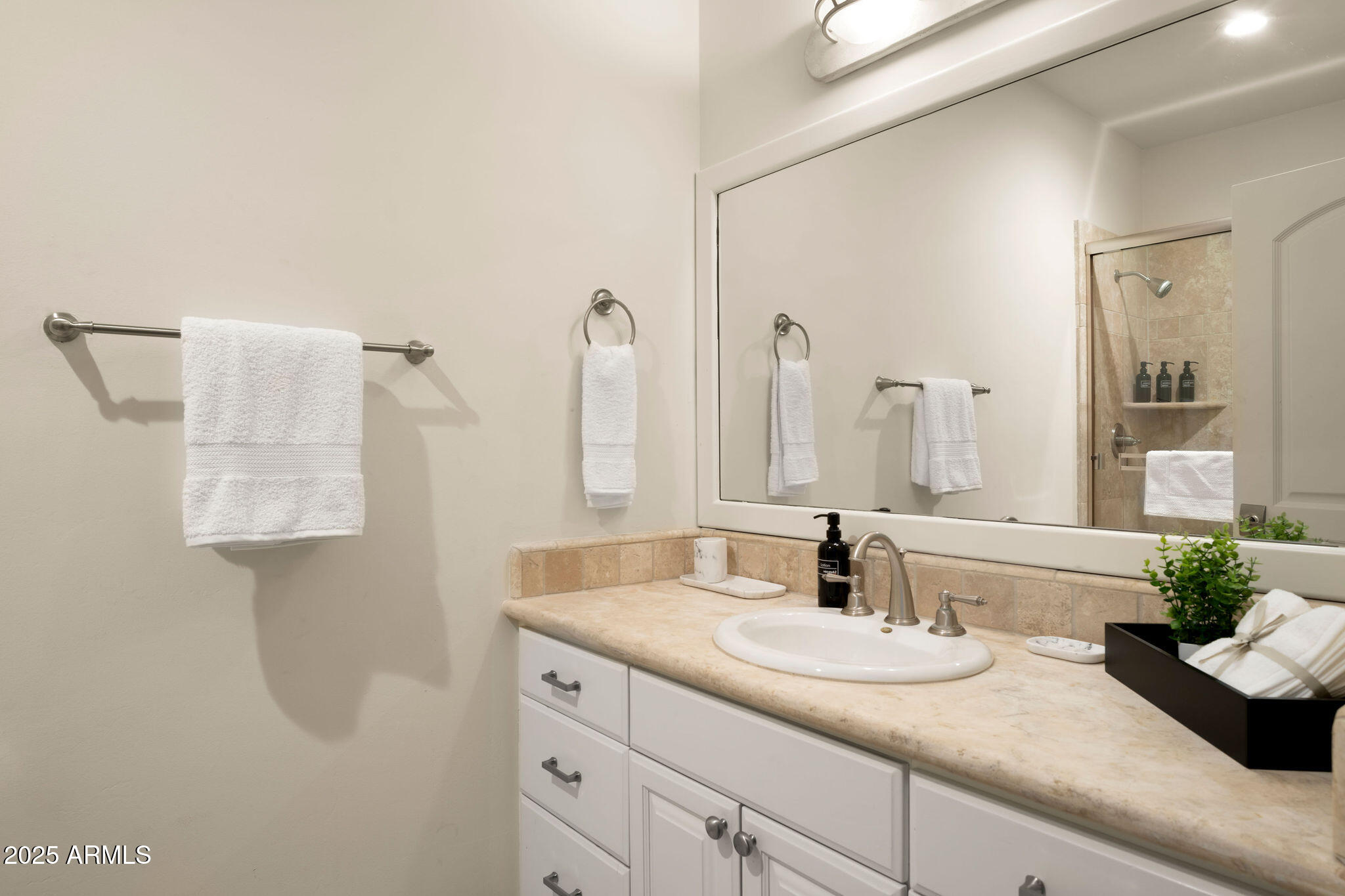 4490 East Valley Vista Lane Paradise Valley, AZ 85253 - Photo 32 of 45 a bathroom with a sink and a mirror