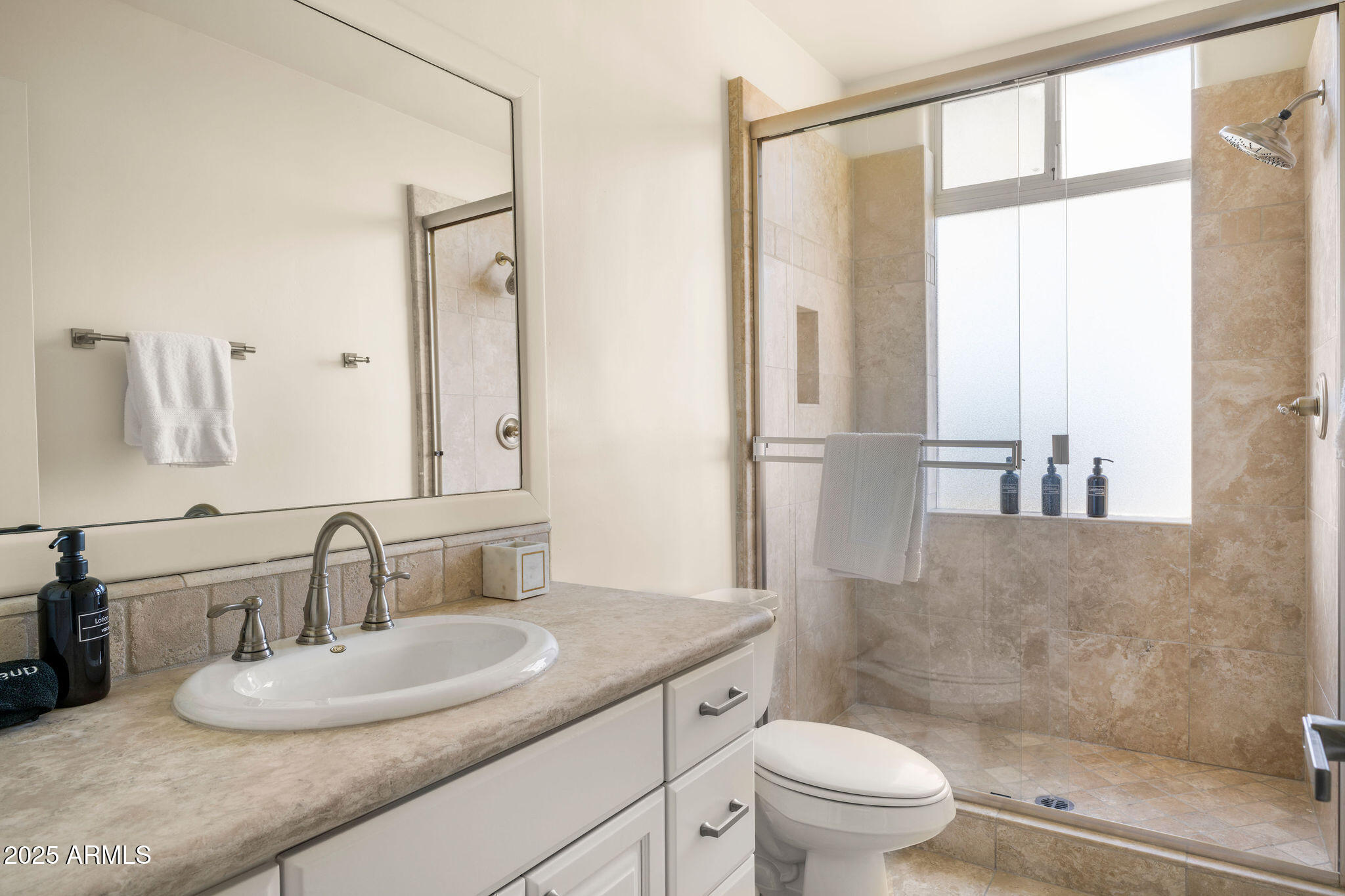 4490 East Valley Vista Lane Paradise Valley, AZ 85253 - Photo 39 of 45 a bathroom with a granite countertop sink toilet and shower