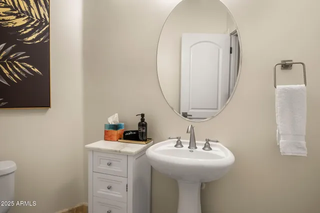 a bedroom with a large bed and a couch