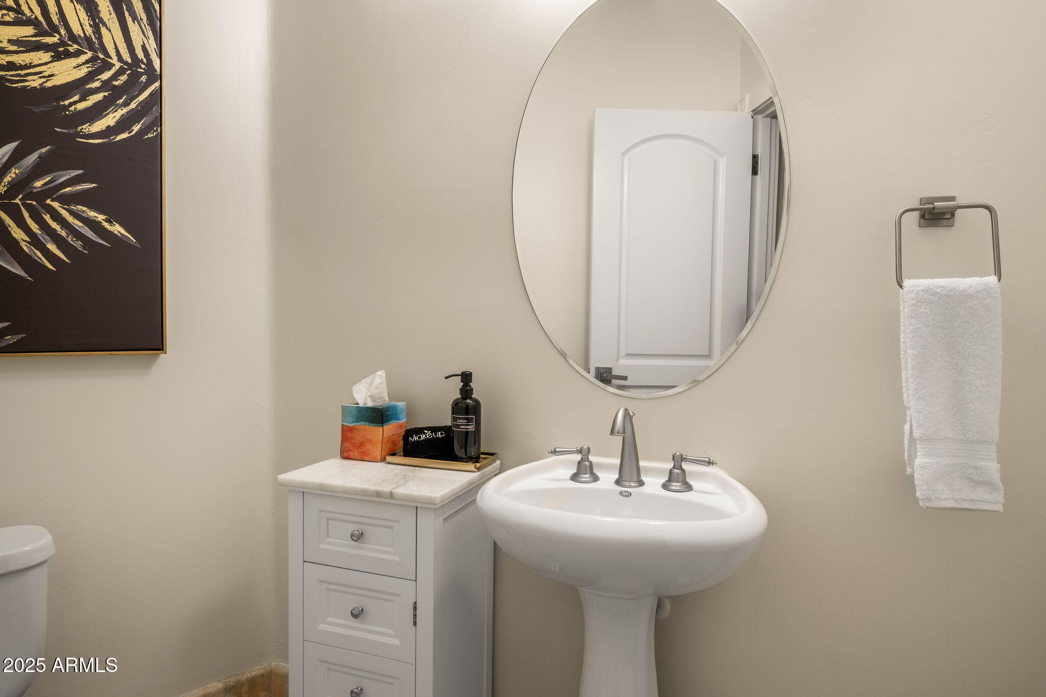 4490 East Valley Vista Lane Paradise Valley, AZ 85253 - Photo 40 of 45 a bathroom with a sink and a mirror