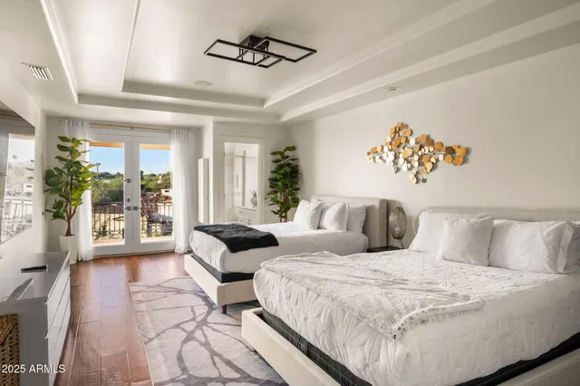 a bathroom with a granite countertop sink toilet and mirror
