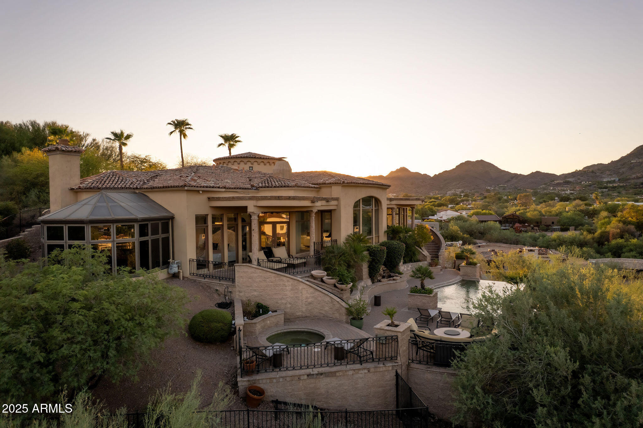4490 East Valley Vista Lane Paradise Valley, AZ 85253 - Photo 44 of 45 a view of a house with pool and chairs