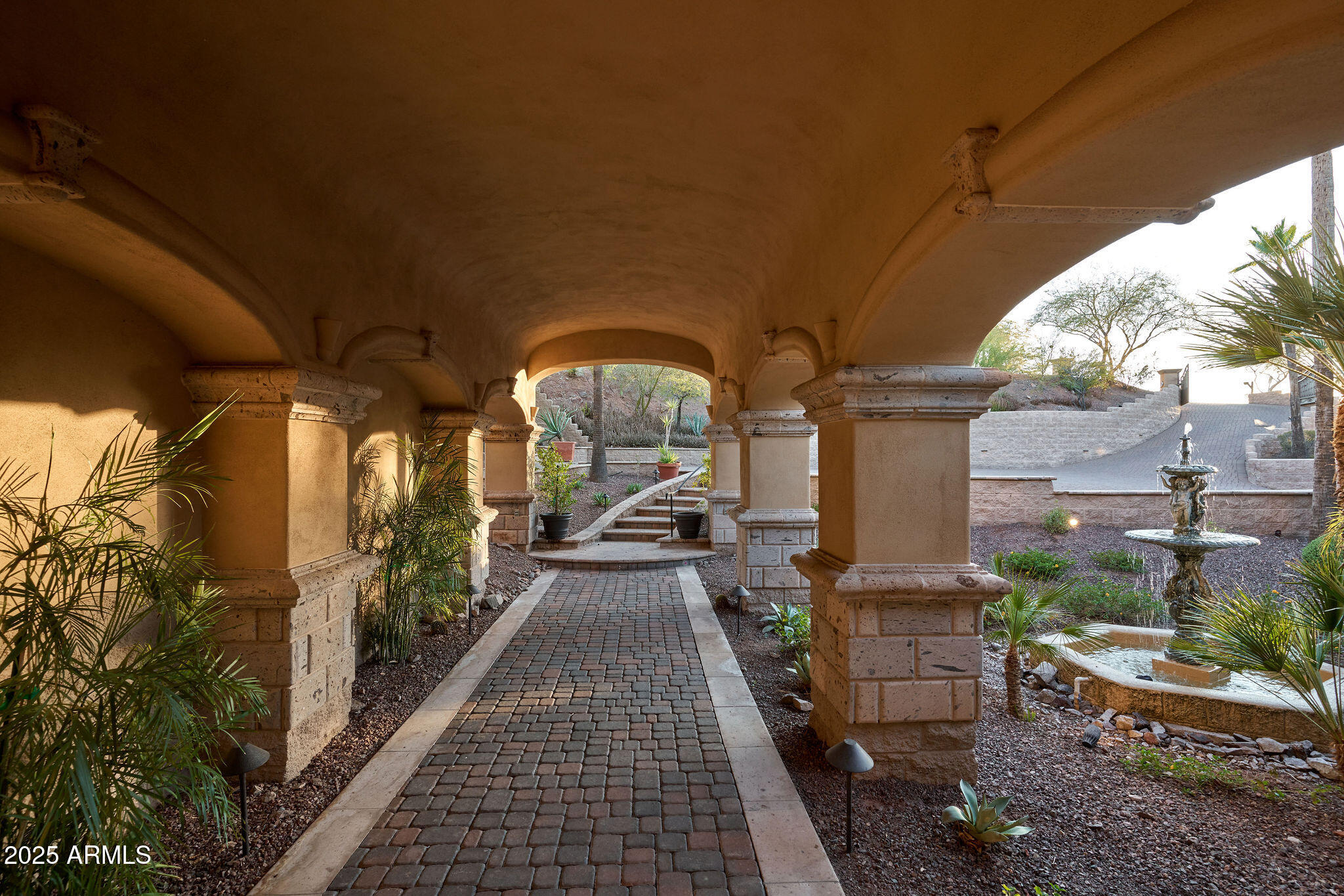 4490 East Valley Vista Lane Paradise Valley, AZ 85253 - Photo 6 of 45 a view of a porch with chairs and potted plants