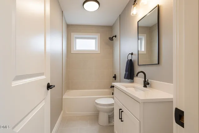 a bedroom with a bed and a large mirror