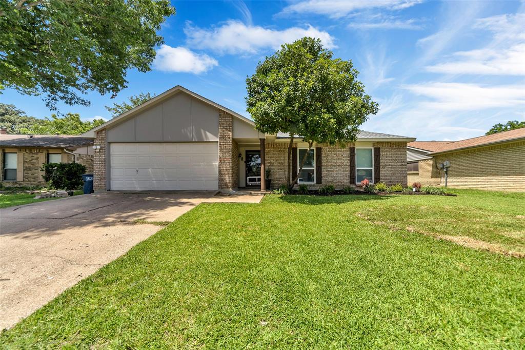 4113 Juneberry Street Fort Worth, TX 76137 - Photo 1 of 36 a front view of house with yard and green space