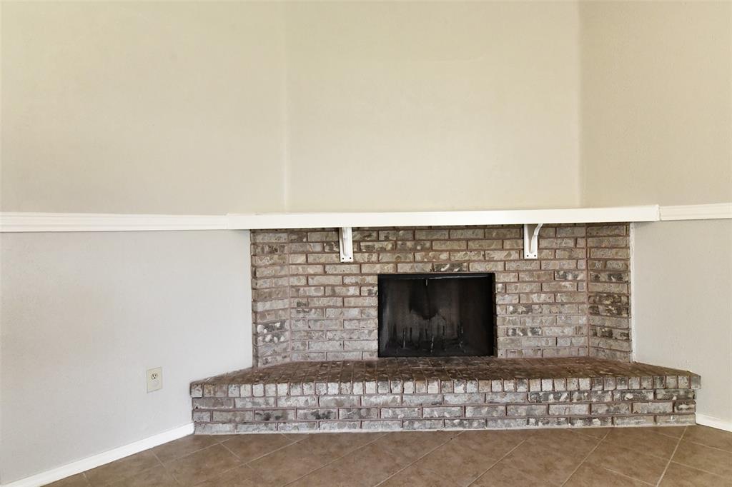 4113 Juneberry Street Fort Worth, TX 76137 - Photo 13 of 36 a view of fireplace and window