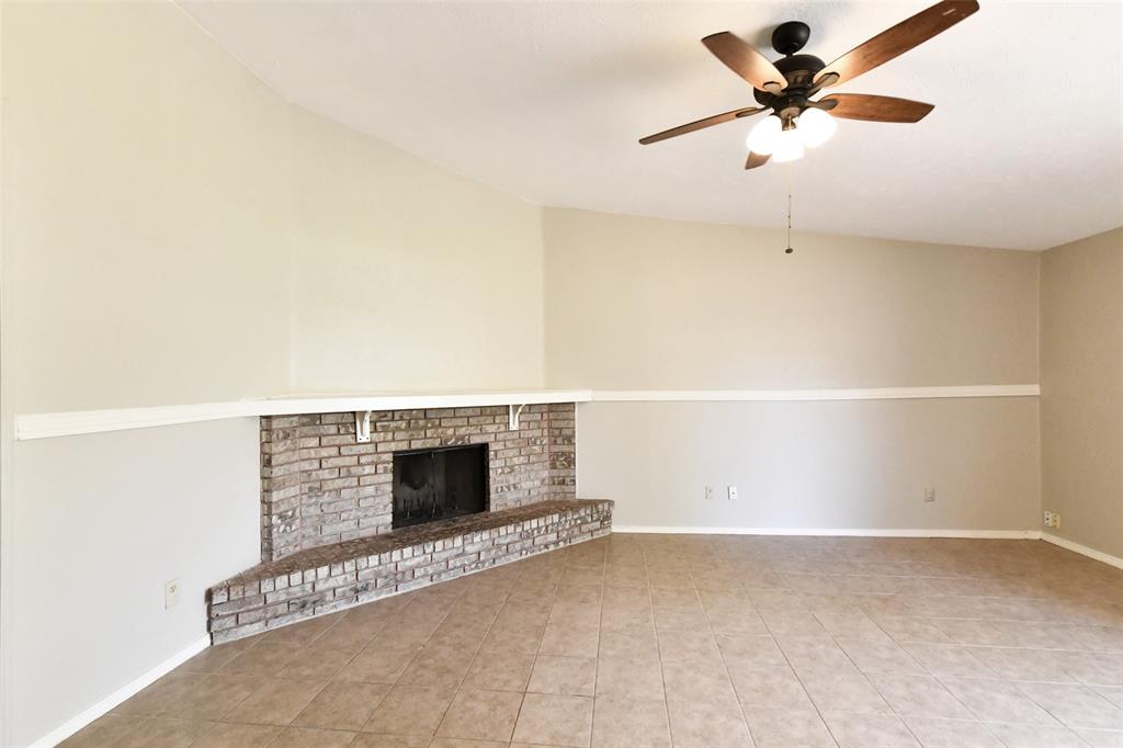 4113 Juneberry Street Fort Worth, TX 76137 - Photo 14 of 36 an empty room with a ceiling fan and carpet