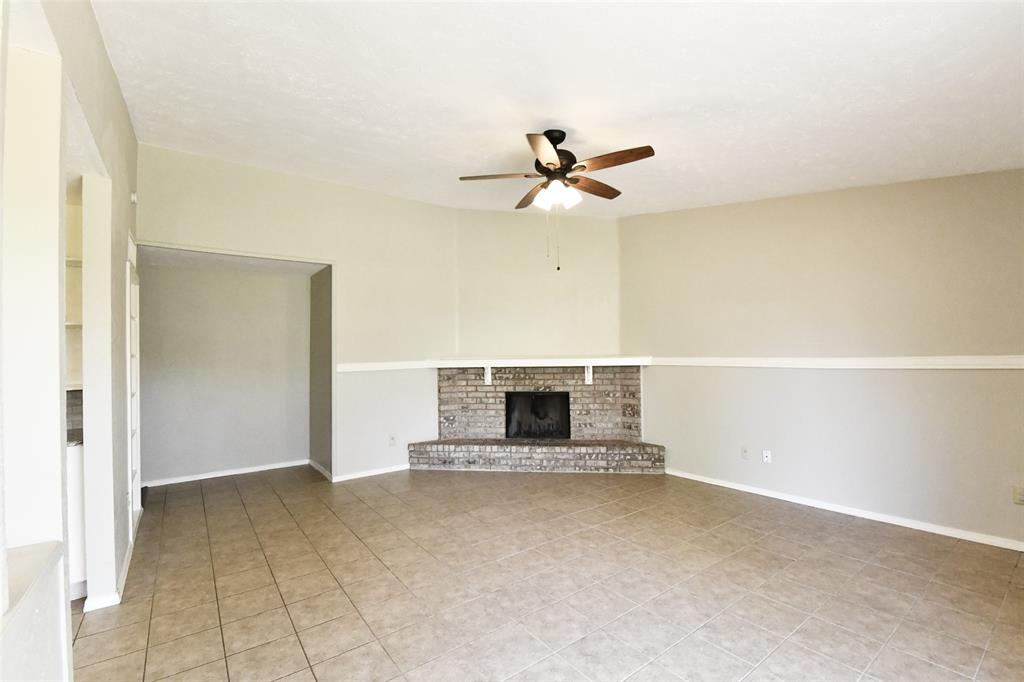 4113 Juneberry Street Fort Worth, TX 76137 - Photo 15 of 36 a view of an empty room with a fireplace