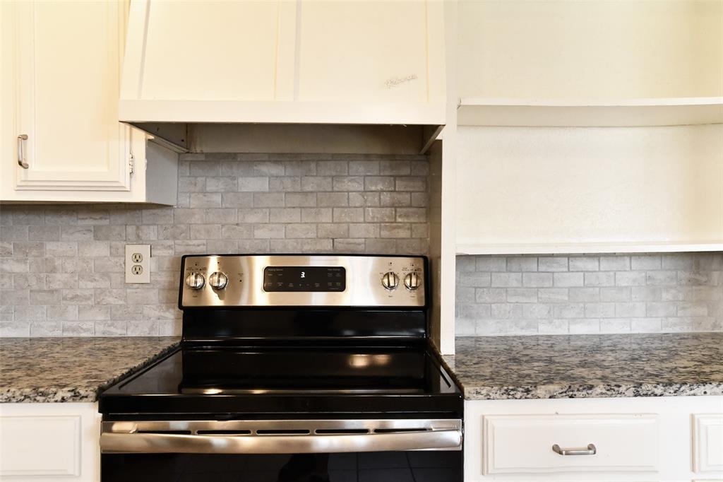4113 Juneberry Street Fort Worth, TX 76137 - Photo 20 of 36 a stove top oven sitting inside of a kitchen