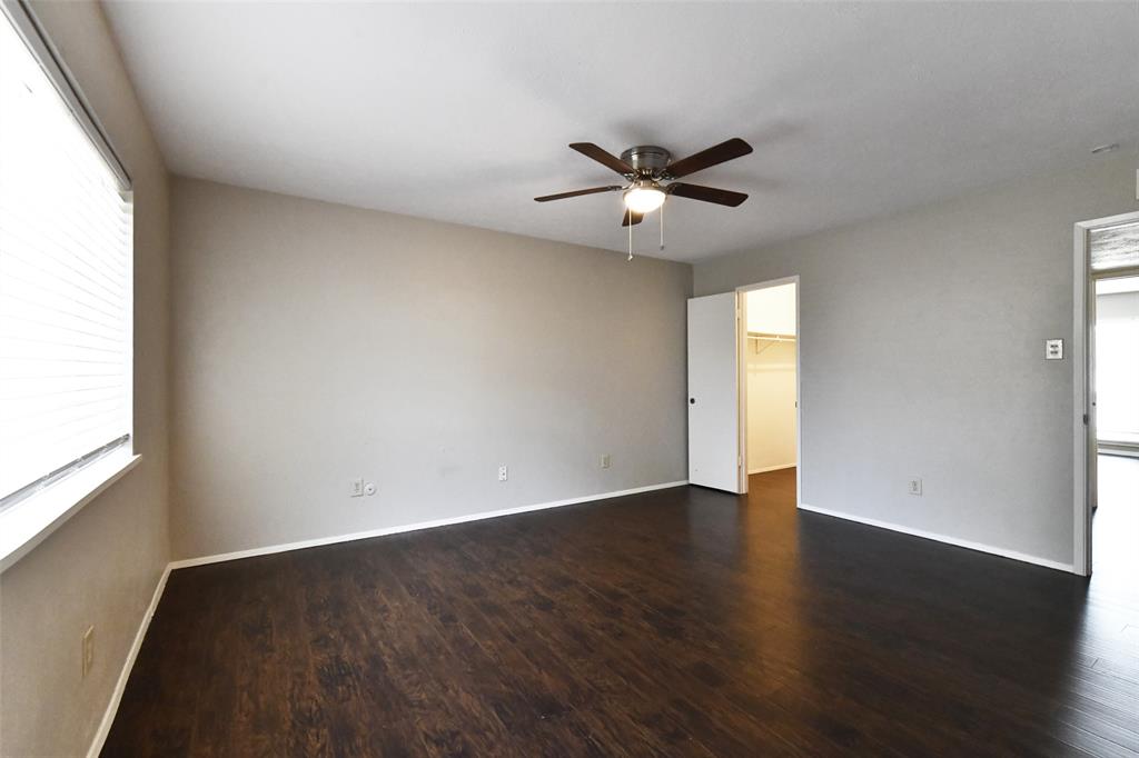 4113 Juneberry Street Fort Worth, TX 76137 - Photo 26 of 36 a view of an empty room with wooden floor and a window
